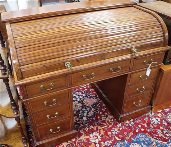 An Edwardian satinwood banded and strung mahogany tambour pedestal desk by Maple & Co. W.120cm